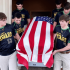 High school seniors carry the casket of Air Force veteran with no family
