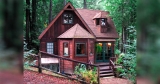 Meet ‘Dreamcatcher’ — the rustic forest cabin with a surprise on the back patio