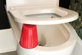 The Mystery of the Red Cups Under the Toilet Seats: Why Do People Place Them There?